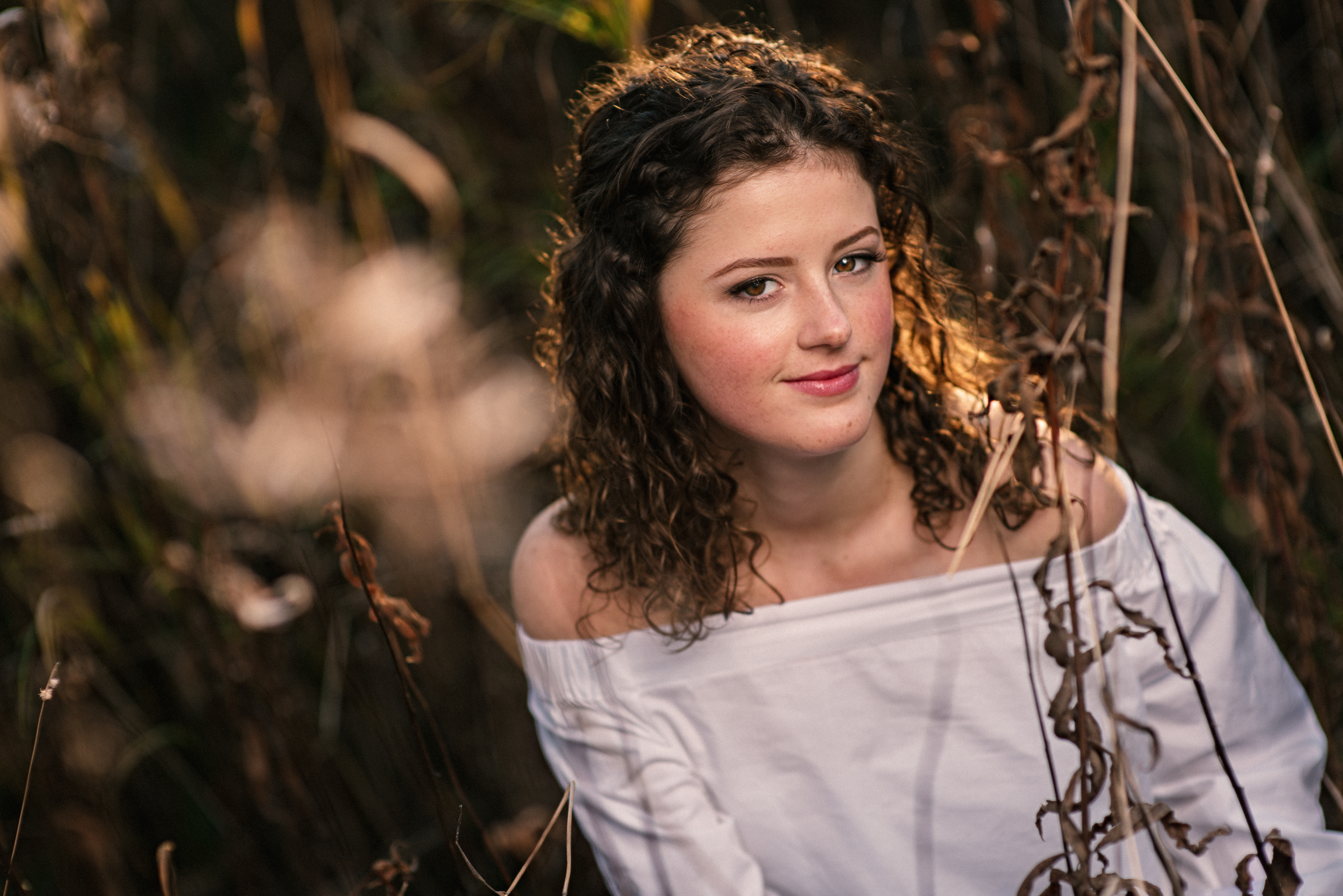 anchorage senior pictures field in the fall curly hair brunette white blouse